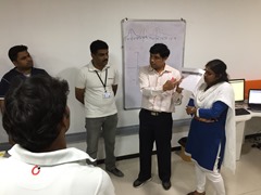 Trainer explaining how to run feature explanation meetings